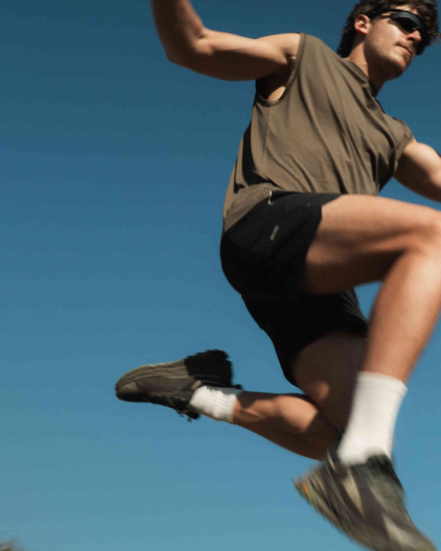 Model in Black Running shorts, lightweight shell, 4-way stretch, moisture wicking and breathable fabric